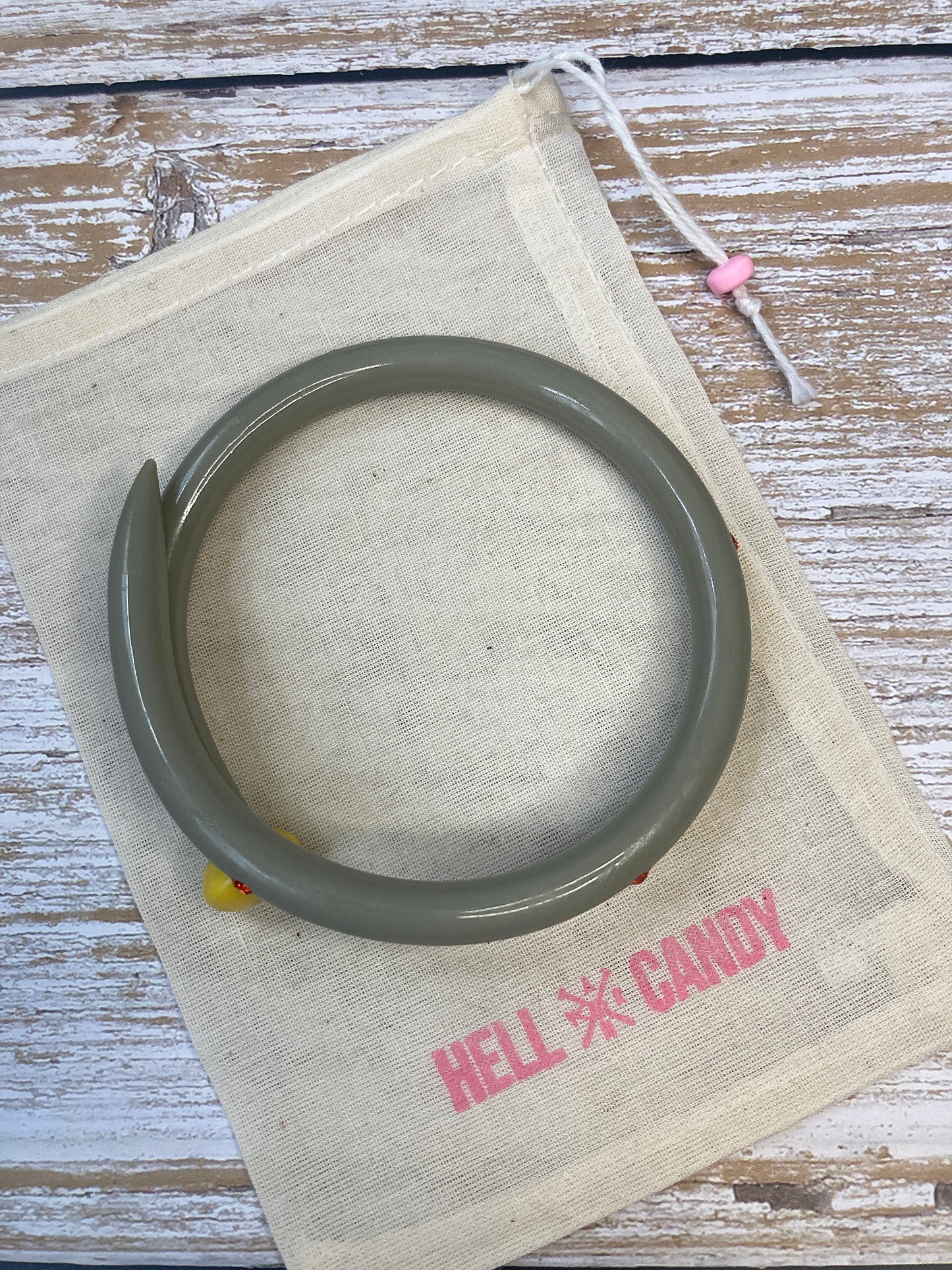 Hellcandy | Knitting Bangle - grey with orange diamante crystals